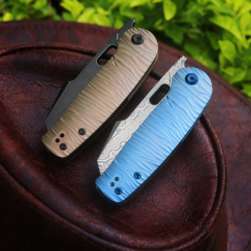 KANSEPT Orlok Thumb Hole Bronze Anodized Titanium with Micro Rock Text — Kanseptknives